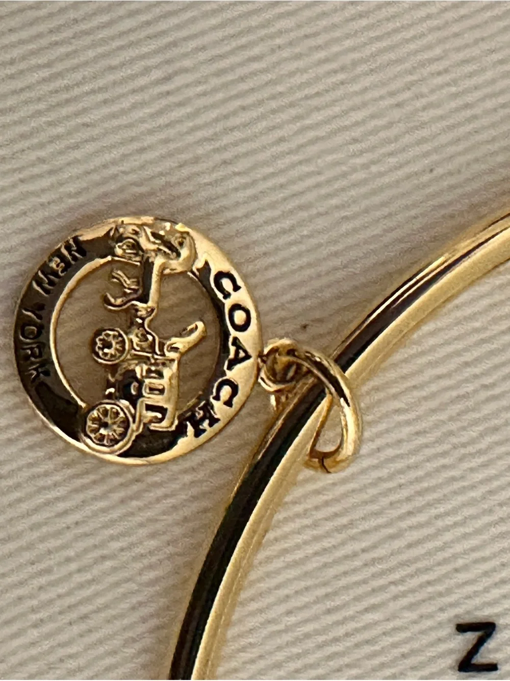 Coach delicate gold